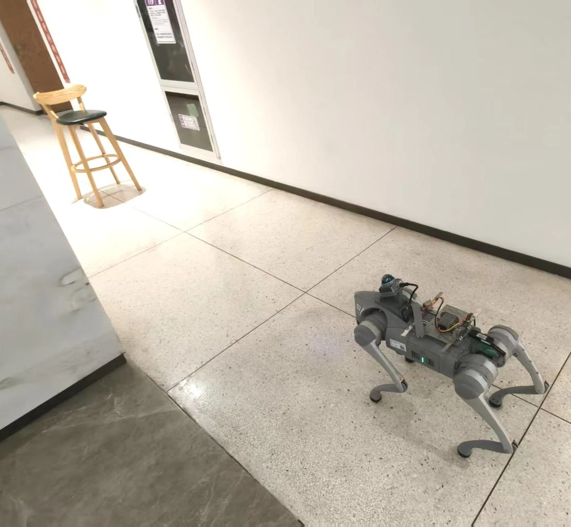 A Unitree Go2 robot turns at the end of a hallway to seek evidence.